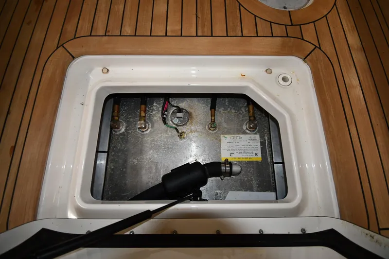 Slide: The Image of 2020 Sea Ray SLX 400 Outboard engine compartment with teak flooring. - 47
