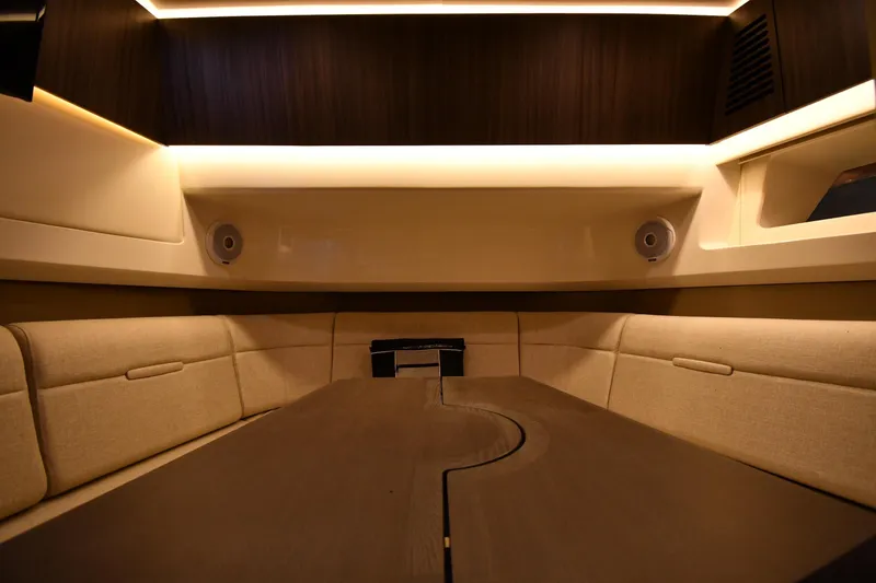 Slide: The Image of Luxurious interior of 2020 Sea Ray SLX 400 Outboard with elegant seating and ambient lighting. - 49