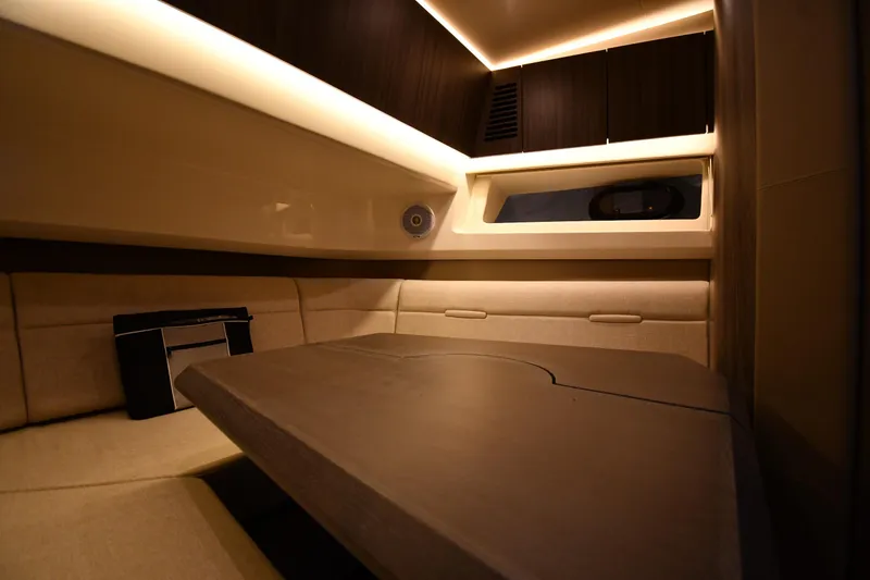 Slide: The Image of Luxurious interior cabin of 2020 Sea Ray SLX 400 Outboard with ambient lighting. - 50