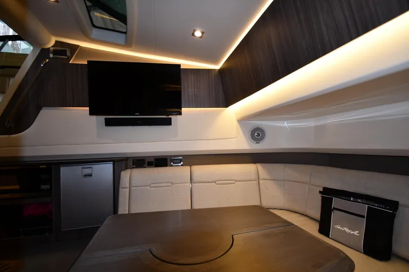Slide: The Image of Luxurious interior of 2020 Sea Ray SLX 400 Outboard with seating, TV, and modern lighting. - 53