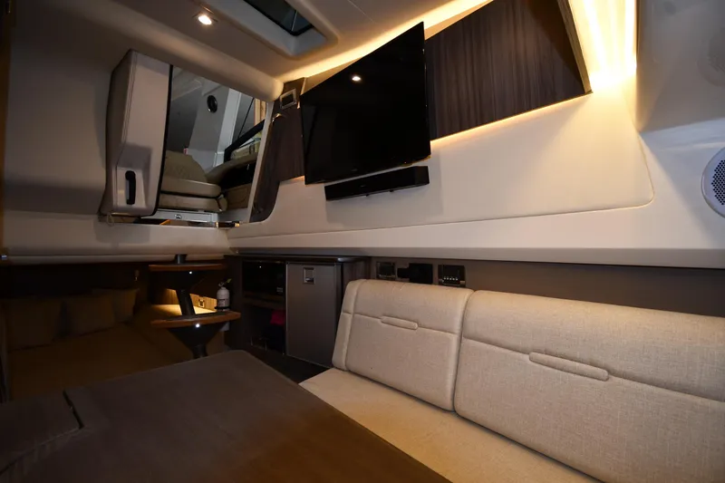 Slide: The Image of Luxurious interior of 2020 Sea Ray SLX 400 Outboard with modern seating and entertainment system. - 54