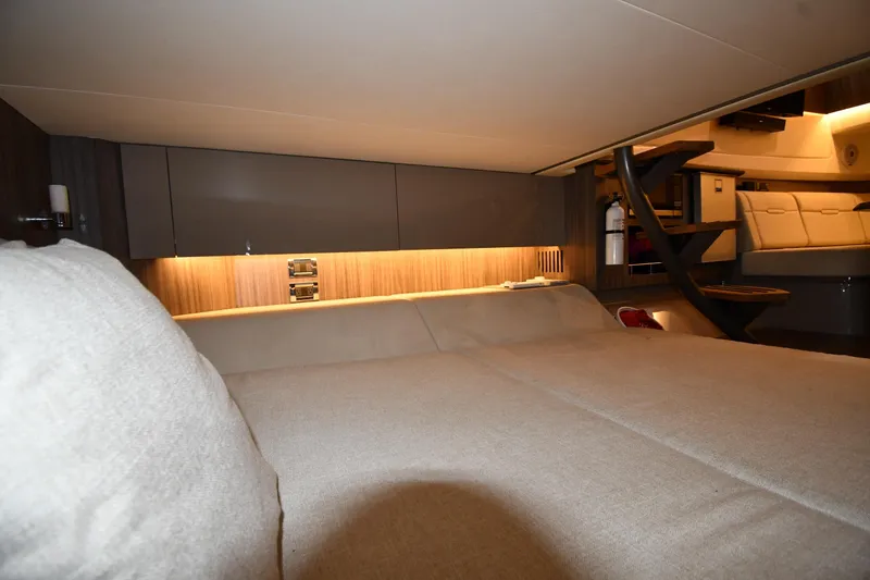 Slide: The Image of Interior cabin of 2020 Sea Ray SLX 400 Outboard, featuring cozy seating and modern design. - 60