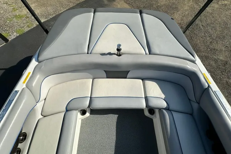 Slide: The Image of 2006 Centurion Enzo SV230 boat interior with gray and white seating. - 11