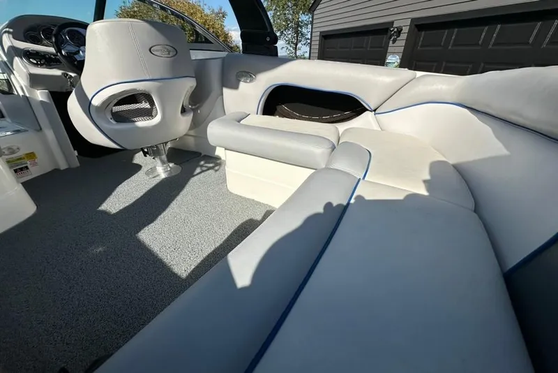 Slide: The Image of 2006 Centurion Enzo SV230 boat interior with gray and white seating, blue accents. - 12