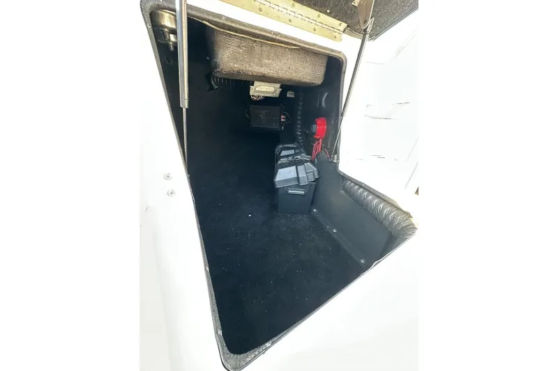 Slide: The Image of Storage compartment of a 2006 Centurion Enzo SV230 boat, featuring interior components. - 20