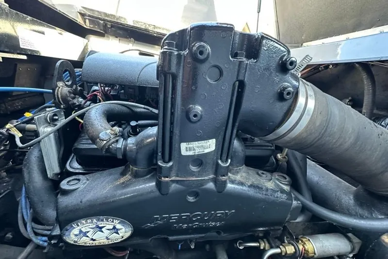 Slide: The Image of 2006 Centurion Enzo SV230 engine close-up, showcasing mechanical components and ultra-low emissions label. - 23