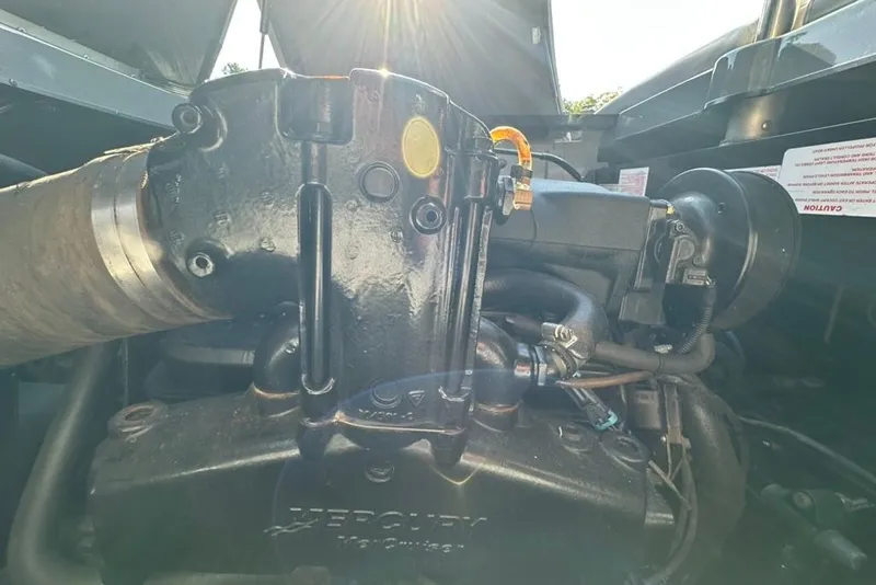 Slide: The Image of 2006 Centurion Enzo SV230 engine with sunlight highlighting components. - 24