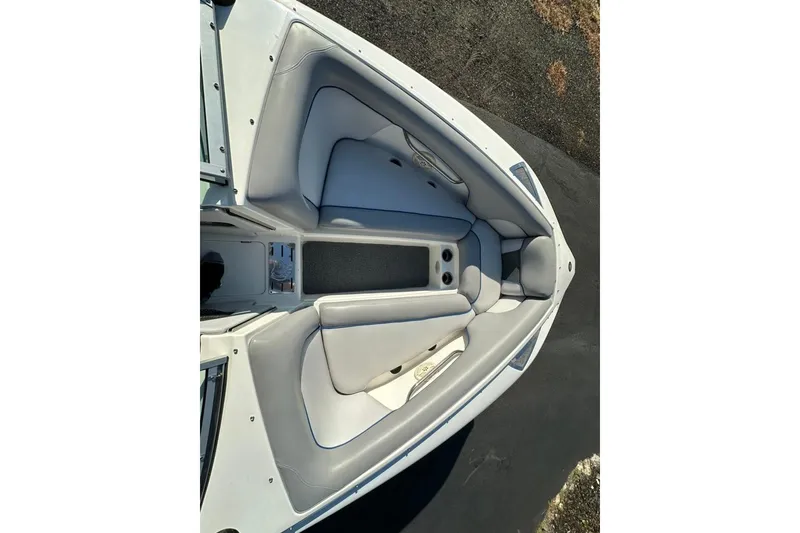 Slide: The Image of 2006 Centurion Enzo SV230 boat interior with gray seating and storage compartments. - 25