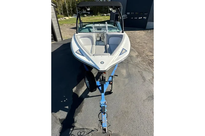 Slide: The Image of 2006 Centurion Enzo SV230 boat on trailer, parked outdoors. - 3