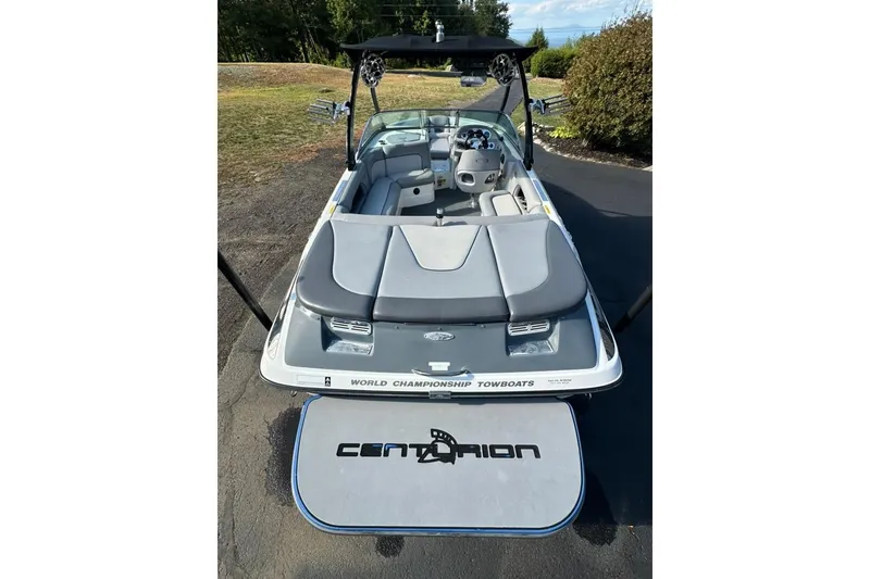Slide: The Image of 2006 Centurion Enzo SV230 boat with sleek interior and "World Championship Towboats" branding. - 8