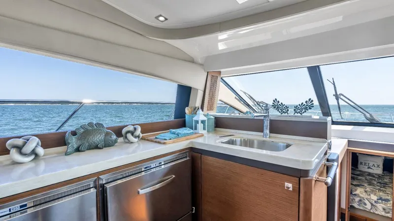 Slide: The Image of Luxurious bathroom in 2015 Sea Ray 510 Fly yacht with modern fixtures and wooden accents. - 14