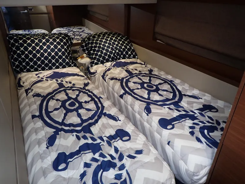 Slide: The Image of Luxurious bedroom in 2015 Sea Ray 510 Fly yacht with floral bedding and "Relax" pillow. - 38
