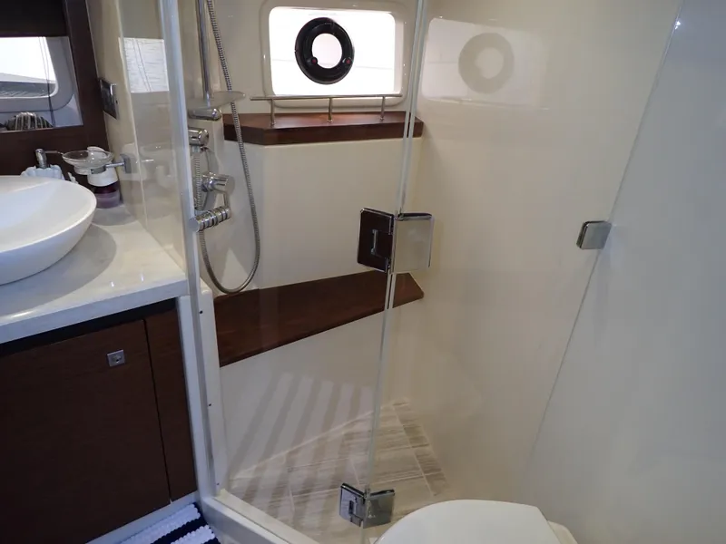 Slide: The Image of Washing machine in 2015 Sea Ray 510 Fly yacht interior, under stair storage. - 44