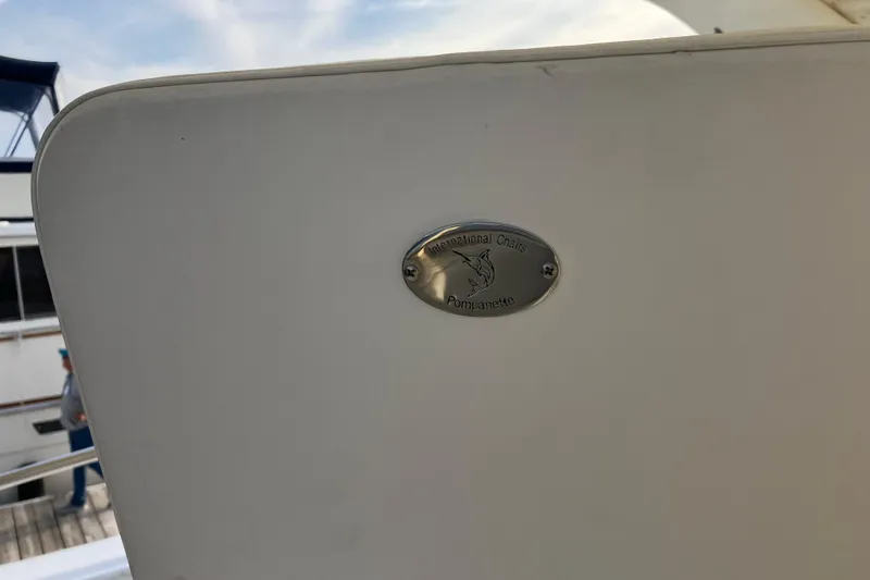 Slide: The Image of 1987 Bertram 42 Convertible boat with Pompanette International Chairs logo. - 18