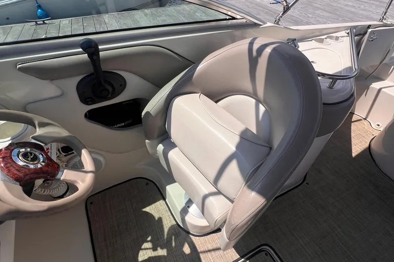 Slide: The Image of 2003 Sea Ray 240 Sundeck dashboard with Garmin GPS and wood grain finish. - 10