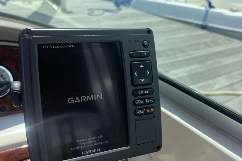 Slide: The Image of VHF marine radio on 2003 Sea Ray 240 Sundeck, displaying channel 07. - 12