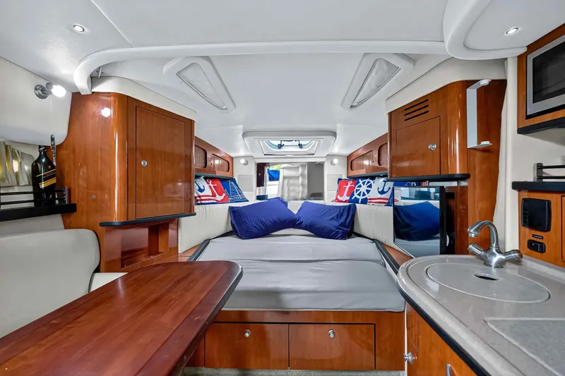 Slide: The Image of Luxurious interior of 2007 Sea Ray 290 Sundancer with cozy seating and modern amenities. - 27