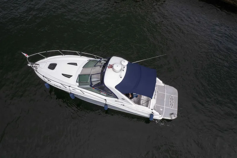 Slide: The Image of 2007 Sea Ray 290 Sundancer boat on calm water, aerial view. - 3