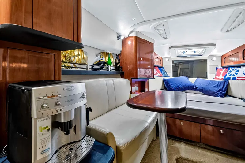 Slide: The Image of Luxurious interior of 2007 Sea Ray 290 Sundancer yacht with cozy seating and coffee maker. - 30