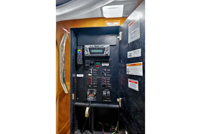 Slide: The Image of Electrical control panel inside 2007 Sea Ray 290 Sundancer boat cabin. - 39
