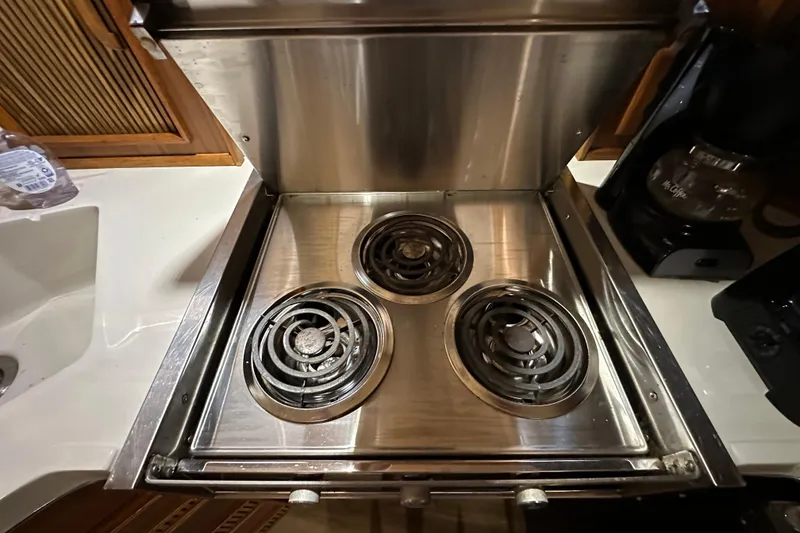 Slide: The Image of Stainless steel stove in 1987 Sea Ray 340 Sundancer yacht kitchen. - 30