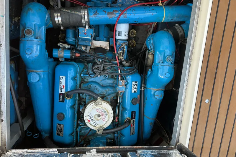 Slide: The Image of Engine compartment of a 1987 Sea Ray 340 Sundancer with blue Crusader engine. - 45