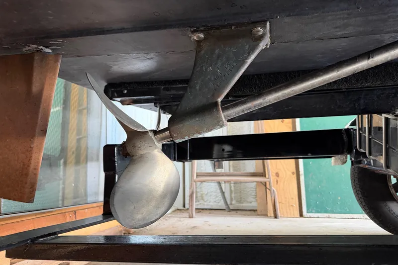Slide: The Image of Propeller of a 1964 Shepherd 22 boat, showcasing its underside mechanics. - 24