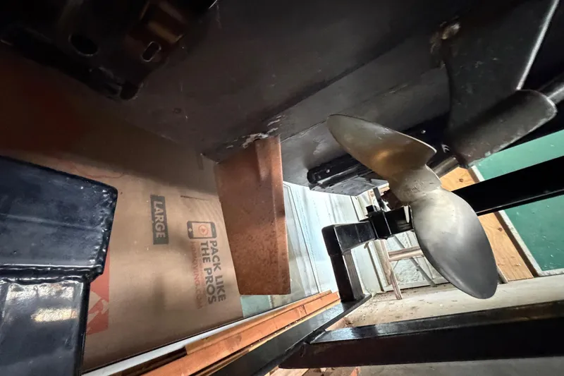 Slide: The Image of 1964 Shepherd 22 boat propeller and engine components in a storage area. - 29