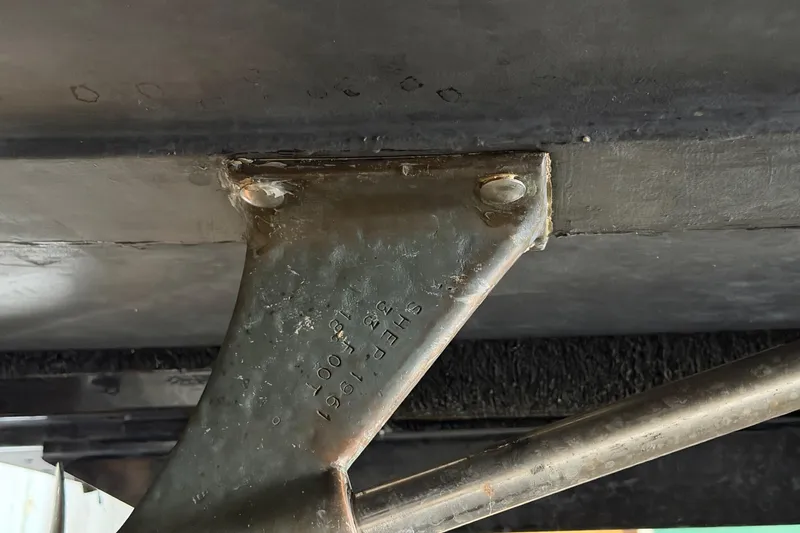 Slide: The Image of Close-up of a 1964 Shepherd 22 metal bracket with engraved details. - 32