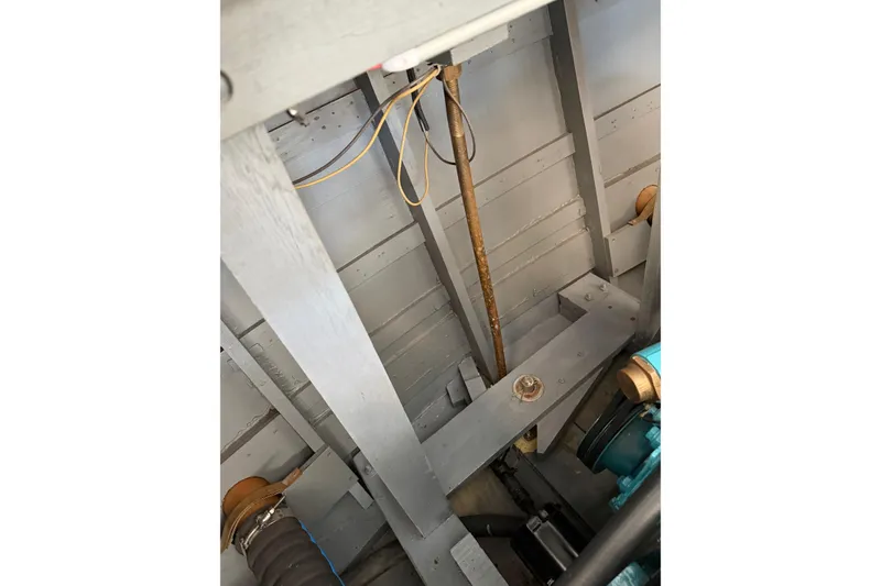 Slide: The Image of Interior view of a 1964 Shepherd 22 boat, showcasing structural components and wiring. - 34