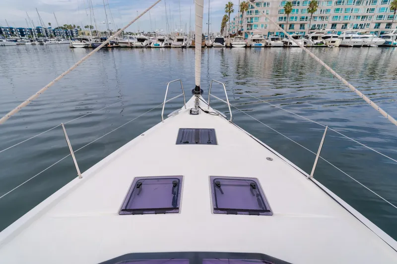 Slide: The Image of Bow view of 2024 Dufour 470 yacht docked in a marina. - 18