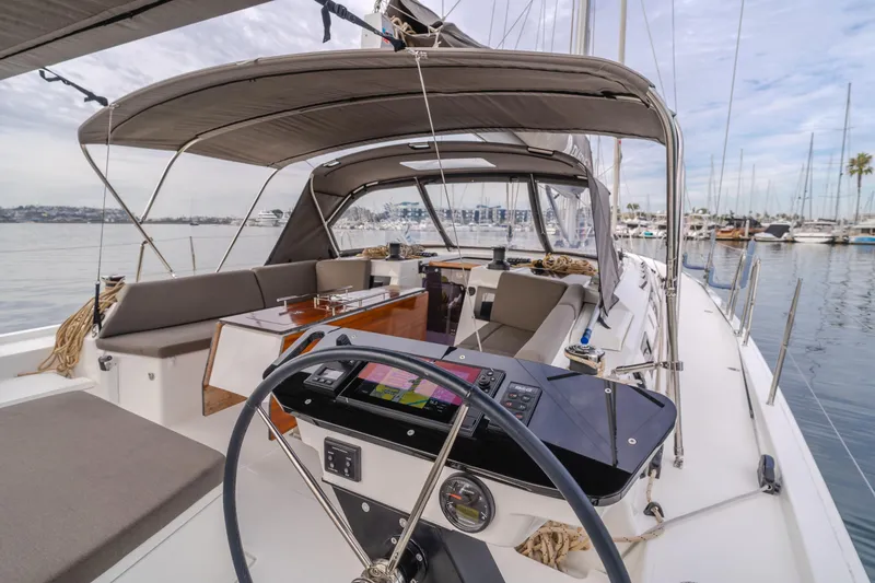 Slide: The Image of 2024 Dufour 470 yacht cockpit with modern navigation equipment and comfortable seating. - 24