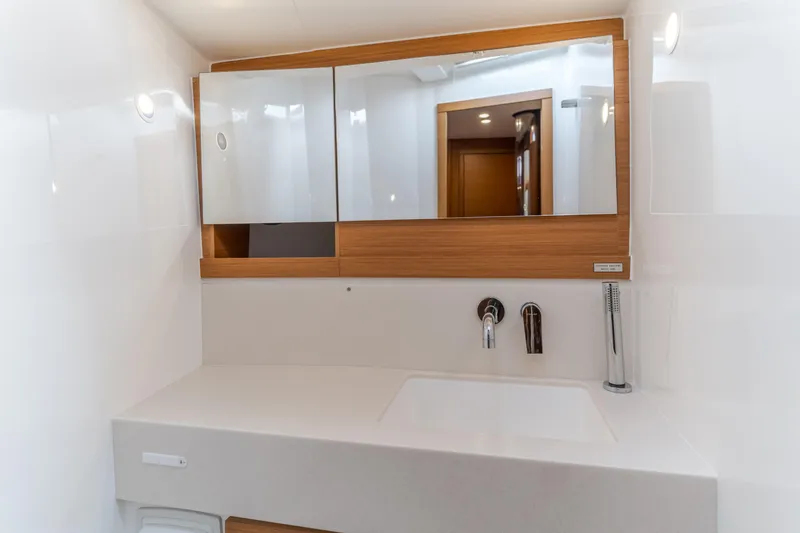 Slide: The Image of Modern bathroom vanity on 2024 Dufour 470 yacht, featuring sleek design and ample storage. - 39