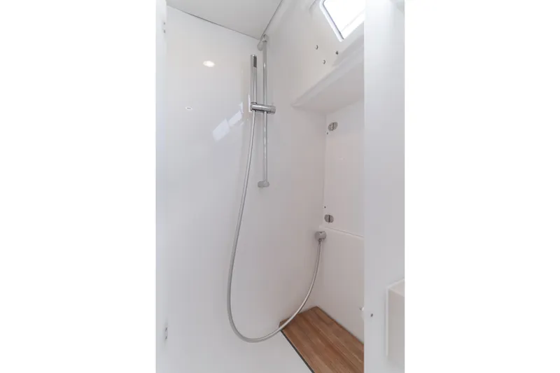 Slide: The Image of 2024 Dufour 470 yacht shower with sleek design and wooden flooring. - 42