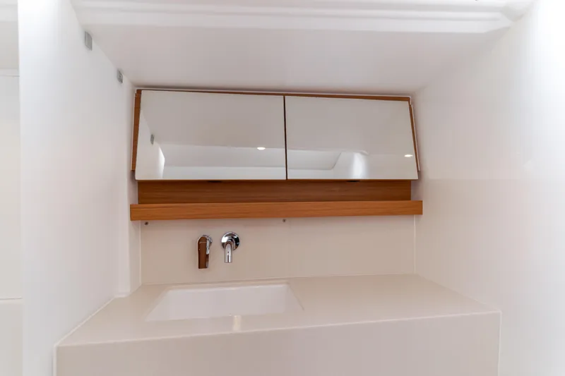 Slide: The Image of Modern bathroom vanity on 2024 Dufour 470 yacht with sleek mirror and faucet. - 43