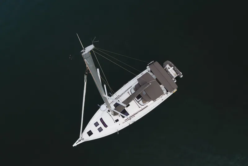 Slide: The Image of Aerial view of 2024 Dufour 470 sailboat on dark water. - 9