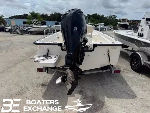 Slide: The Image of Boston Whaler 170 Montauk 2023 with outboard motor on boat trailer. - 2