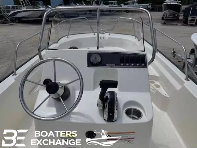 Slide: The Image of Steering console of a 2023 Boston Whaler 170 Montauk boat. - 7