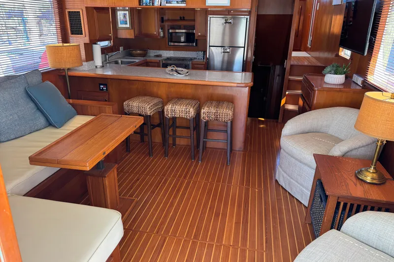 Slide: The Image of Luxurious interior of 2006 DeFever 52 Euro yacht with modern kitchen and cozy seating area. - 16