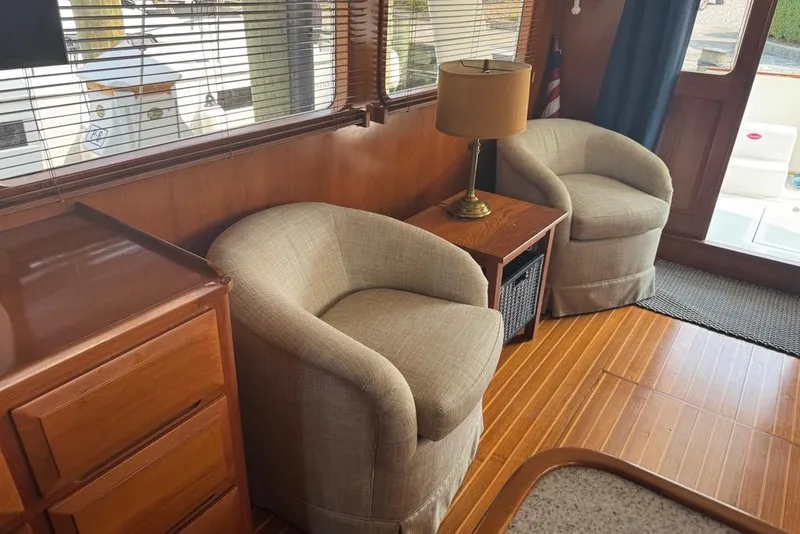 Slide: The Image of Interior of 2006 DeFever 52 Euro yacht with cozy seating and wooden decor. - 17