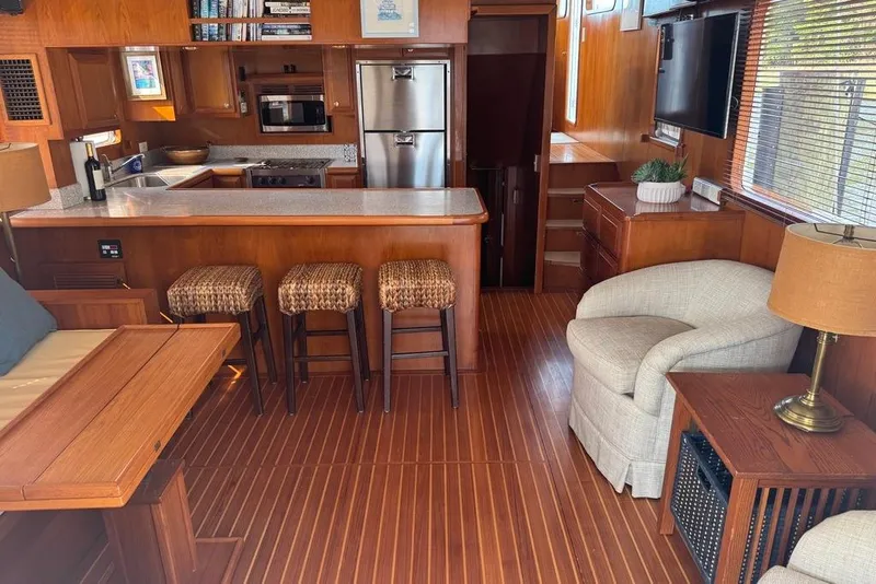 Slide: The Image of Luxurious 2006 DeFever 52 Euro yacht interior with modern kitchen and cozy seating area. - 3