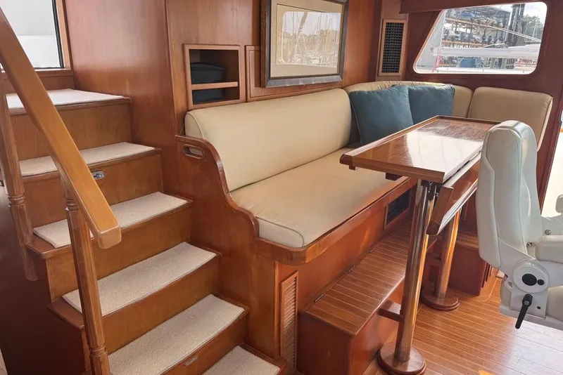 Slide: The Image of Luxurious interior of 2006 DeFever 52 Euro yacht with wooden stairs and seating area. - 30
