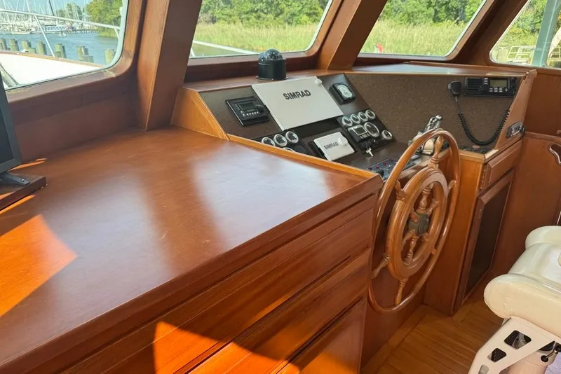 Slide: The Image of Pilothouse of 2006 DeFever 52 Euro yacht with wooden steering wheel and navigation equipment. - 33