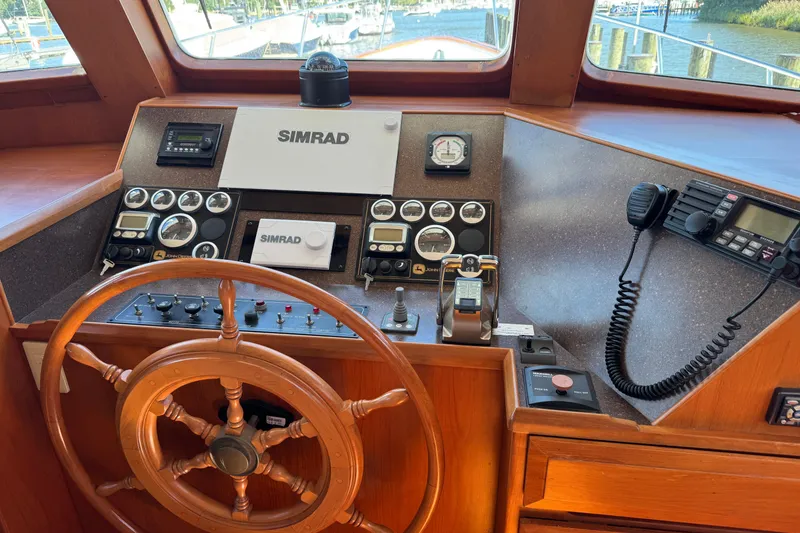Slide: The Image of 2006 DeFever 52 Euro yacht helm with Simrad navigation and communication equipment. - 34