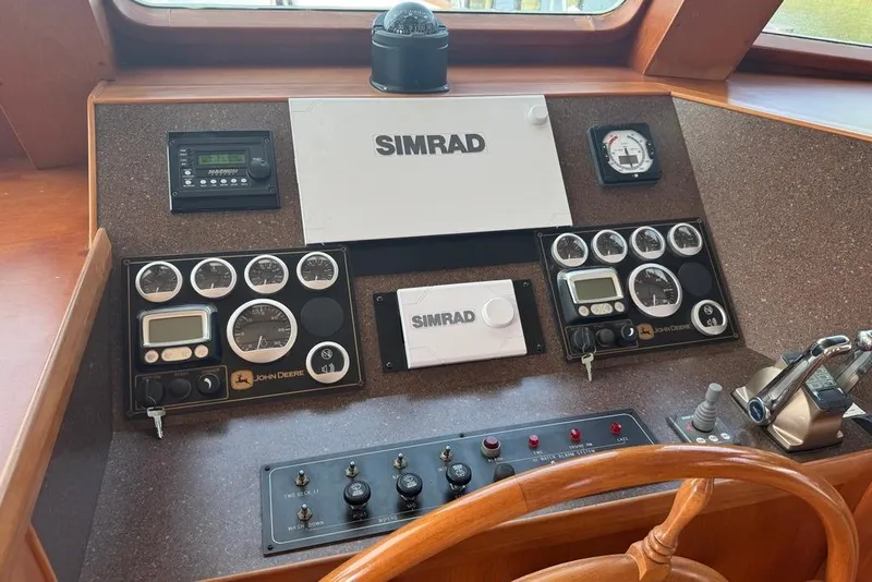 Slide: The Image of Control panel of 2006 DeFever 52 Euro yacht with Simrad navigation system. - 35