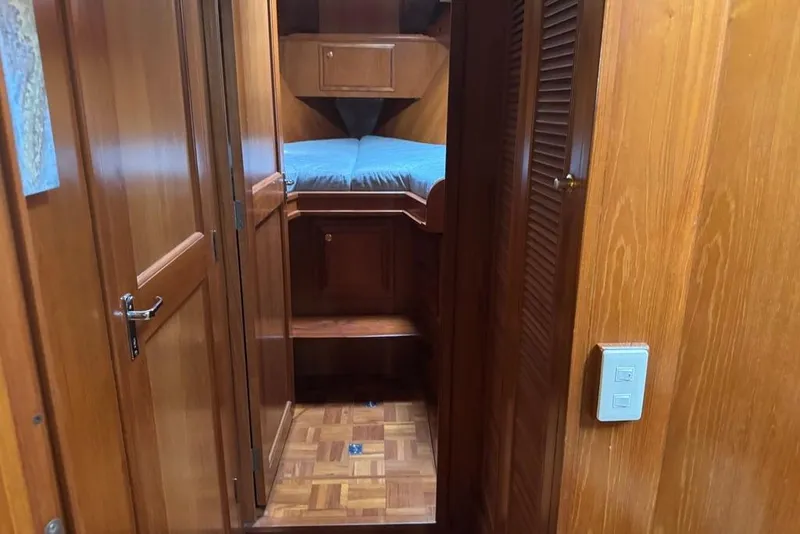 Slide: The Image of Interior of 2006 DeFever 52 Euro yacht with wooden paneling and cozy cabin. - 37