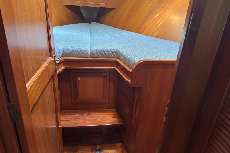 Slide: The Image of Cozy cabin interior of 2006 DeFever 52 Euro yacht with wooden finish and blue bedding. - 38