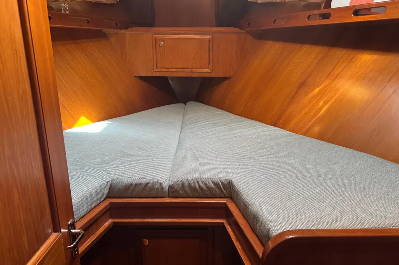 Slide: The Image of Cozy cabin interior of 2006 DeFever 52 Euro yacht with wooden finish and cushioned bed. - 39