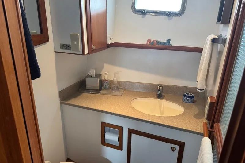Slide: The Image of Bathroom interior of 2006 DeFever 52 Euro yacht with sink and wooden accents. - 40