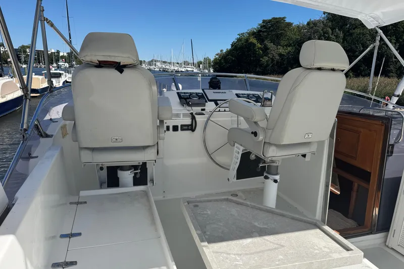 Slide: The Image of 2006 DeFever 52 Euro yacht helm with dual captain chairs and steering wheel. - 47